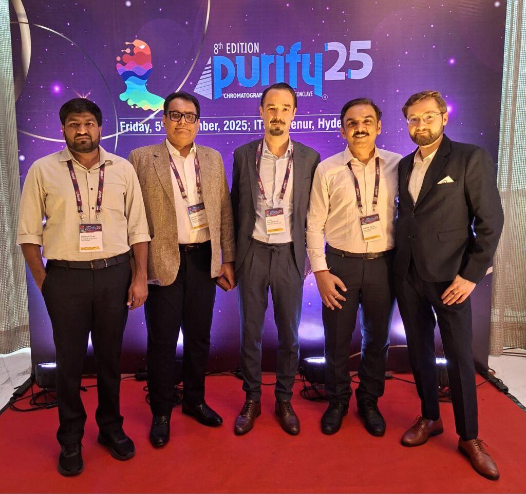 Five delegates in front of the Purify 25 backdrop dated 5 December 2025 at ITC Kohenur, Hyderabad